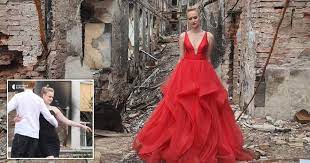 Ukraine teen poses in graduation dress in front of bombed school in powerful picture