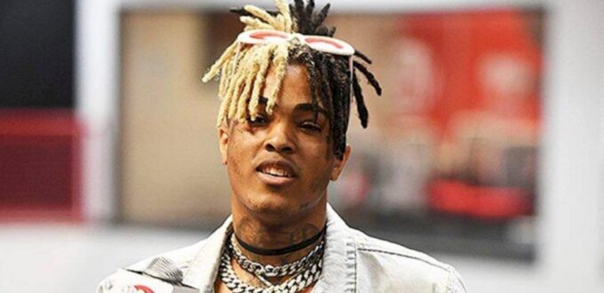 Jahseh Dwayne Ricardo Onfroy, AKA XXXTentacion, was born on January 23, 1998, in Plantation, Florida. He spent the majority of his childhood with his grandmother Collette Jones. He changed several schools, due to being expelled from each, mostly for attacking other students. During his time in middle school, he started attending school choir and later church choir, which sparked his interest in music. He attended Piper High School but dropped out in tenth grade. Shortly after, he got arrested for gun possession and spent some time in the juvenile correction center, where he met Stokeley Clevon Goulbourne. After getting out, they started freestyling together and Jahseh, who adopted the name XXXTentaction (tentaction means temptation in Spanish), uploaded his first song, called “Vice City”, on SoundCloud. Source: BPM Supreme news Career In 2016, while working on his first album, XXXTentacion was arrested on several charges and sent to jail. Among other things, he was accused of beating his pregnant girlfriend, Geneva Ayala. After getting out, he continued his musical career, releasing his second album, ?, in 2018. The release was followed by several controversies regarding his label house and his repeated claims of retiring. Death On June 18, 2018, a black SUV blocked XXXTentacion while he was exiting a parking lot. Two armed men approached his car and after a brief confrontation, they stole a bag with $50,000 from him and shot him several times. He was pronounced dead in Broward Health North hospital in Deerfield Beach. Source: Los Angeles Times Three days later, his mother announced that XXXTentacion’s girlfriend was pregnant with his child. His daughter was born on January 26, 2019. XXXTentacion Net Worth 2022 XXXTentacion net worth has been estimated at $2 million. Unfortunately, his life was cut short by the gunmen and he didn’t get a chance to fully develop his talents and make more music, although there were several posthumous releases of his songs, either solo or in a collaboration with other artists.