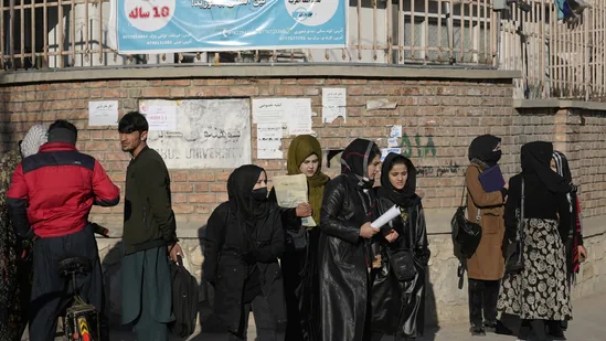 Afghan men walk out of classes to support women banned from colleges .